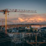 beautiful-view-construction-site-city-during-sunset_181624-9347